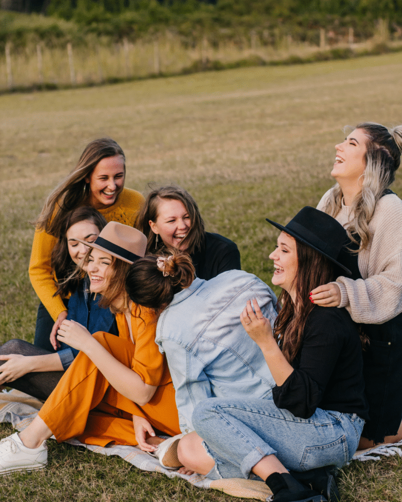 Group of friends sitting on grass